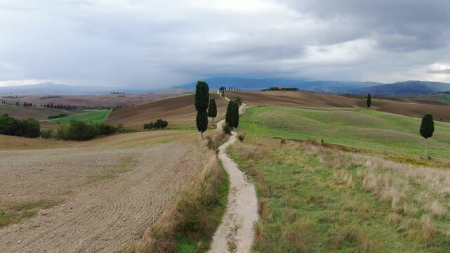 Footage of Gladiator Road in a Spirit of Ancient Roman Empire with Golden Hills on Cloudy Autumn Day. Drone Shot
