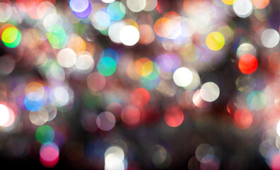 Colorful multicolored bokeh background with soft circles of light in red, green, blue, yellow, violet tones. Perfect for joy, energy, celebration, party design, holiday decor, creative modern projects