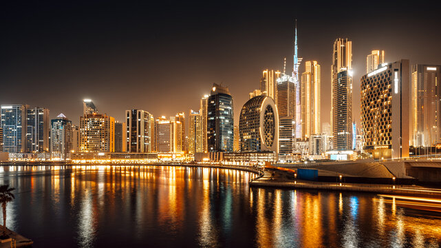 modern buildings of the business bay in dubai at night