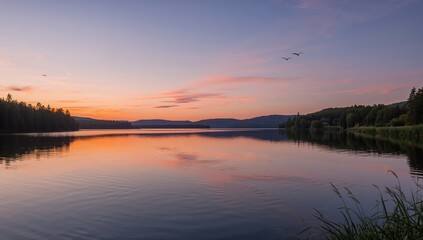 Obraz premium Romantic sunset casting reflections on a tranquil northern lake