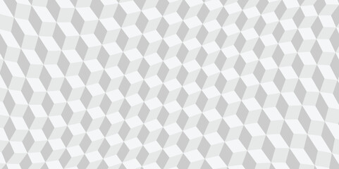 Abstract geometric background featuring a repeating pattern of grey and white 3D cubes or rhombuses, creating an optical illusion of depth. Seamless texture for modern design.