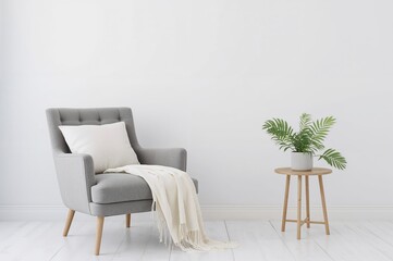 Fototapeta premium Contemporary minimalist living space concepts featuring a classic gray armchair with a white cushion and throw, alongside a table holding a potted green plant against a bright wall backdrop,