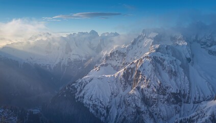 Snow-covered cliffs in the Italian Alps during winter, highlighting seasonal change