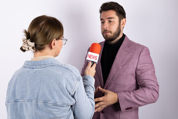 Man and woman interviewed in studio