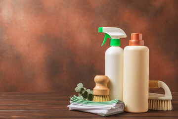 Eco cleaning.Cleaning products on a textured background. Eco-friendly home cleaning. A bottle of natural detergent surfaces, eco brushes, sponges, and rags. Cleaner concept.Cleaning supplies.Flat lay.