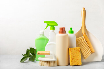 Eco cleaning.Cleaning products on a textured background. Eco-friendly home cleaning. A bottle of...