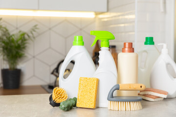 Eco cleaning products against the background of the kitchen. Eco-friendly home cleaning. A bottle...