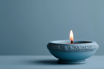 Intricate azure candle flickers serenely in silence, evoking Diwali serenity and tranquility of ancient hanami festivals