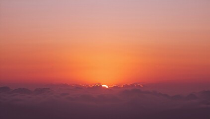 Obraz premium Vibrant sunset casting colorful light through clouds, ideal backdrop for editorial use