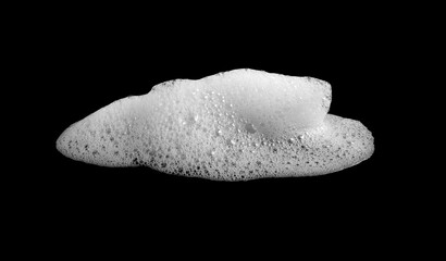 White foam bubble isolated on black background, symbolizing cleanliness, freshness, and hygiene. Perfect for design projects related to cleaning products, beauty, and soap advertising.