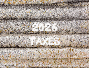 2026 taxes new year symbol. Concept words 2026 taxes on beautiful grey mountain wall. Beautiful grey mountain wall background. Business and 2026 taxes new year concept. Copy space.