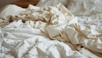 Messy bed with white sheets after waking up, abstract texture in a cozy room setting