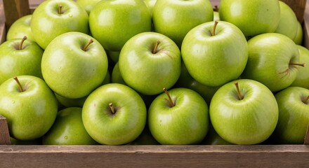 Close-up of fresh green Granny Smith apples in a wooden crate. Healthy organic fruit from the autumn harvest