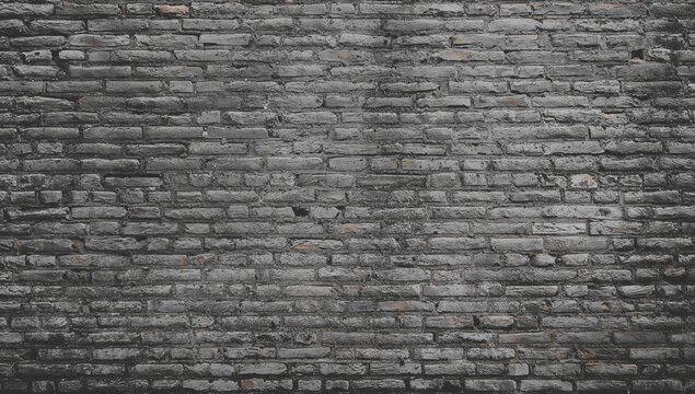 Fototapeta Aged brick surface with gray tones, serving as a textured backdrop