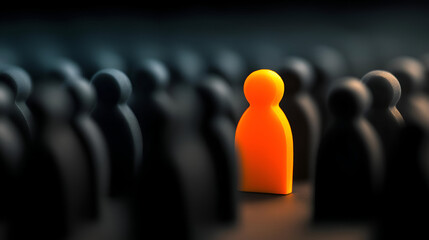 An orange figure stands out among dark silhouettes, representing individuality and uniqueness in a crowd.