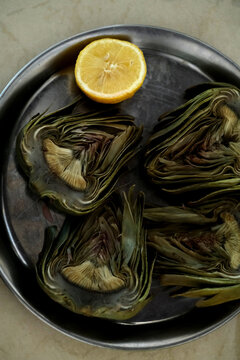 cooked artichoke with lemon