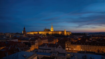 Obraz premium Urban nightscape featuring a towering TV structure and historic buildings