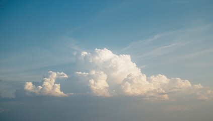 Fototapeta premium Cumulus clouds drifting in a clear blue sky, seasonal change