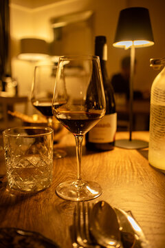 glasses of red wine and a bottle of wine before dinner in a cosy restaurant to celebrate