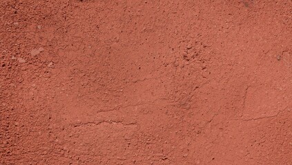 Aged stucco wall texture, detailed close-up of rough red cement surface, concrete backdrop for architectural design