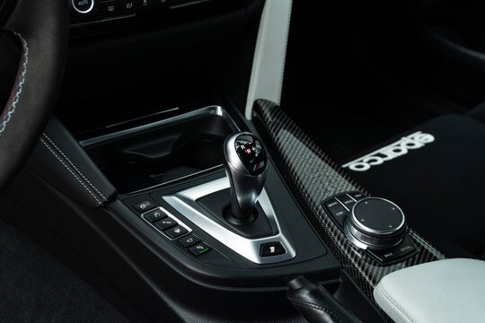 BMW M4 automatic gear shifter on carbon fiber console, Luxury coupe interior detail