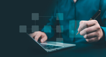 Businessman using laptop with digital flowchart interface, symbolizing process planning, workflow management, automation, and innovation in modern business technology.