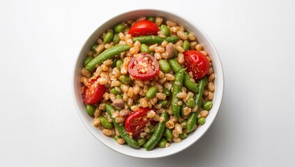 Bowl filled with pearl barley, broad beans, and cherry tomatoes, a protein-rich meal