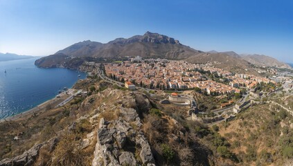 Aerial view of an ancient fortress town surrounded by water, urban density, preservation
