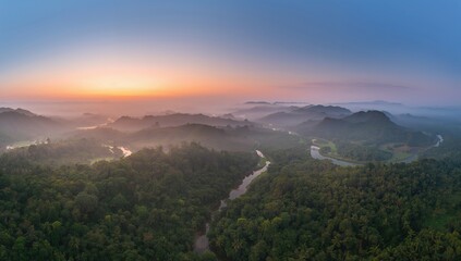 Obraz premium Aerial view of Borneo Rainforest during early mist, highlighting seasonal change