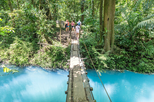 Suspension wooden bridge crossing Rio Celeste river, Costa Rica