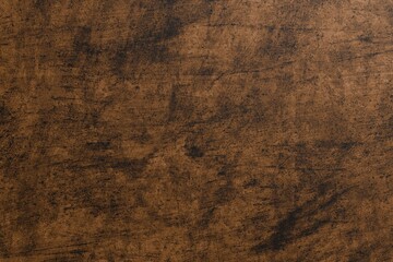 Dark, mottled brown background with subtle scratches and textures, resembling distressed wood or...