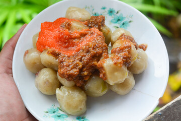 Cilok is made from tapioca or aci flour and served by plugging, cilok is a round shaped snack with a chewy texture and served with peanut sauce