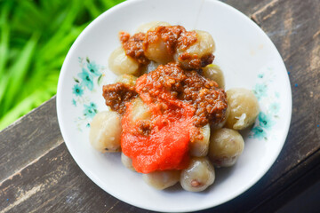 Cilok is made from tapioca or aci flour and served by plugging, cilok is a round shaped snack with a chewy texture and served with peanut sauce