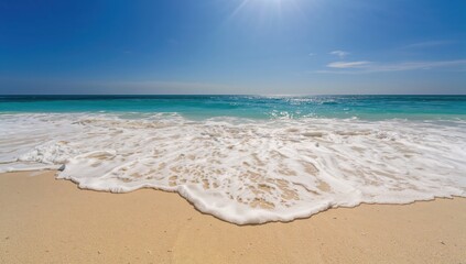 Ocean waves gently washing over sandy shore in summer