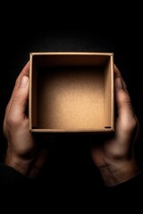 Hands present an empty brown cardboard box, symbolizing opportunity, potential, or a blank canvas.