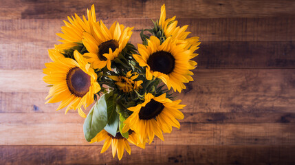 sunflower. Vibrant sunflower arrangement on a rustic wooden surface, bathed in warm natural light from above. gardening catalogs, home-decor guides, designed for home decor and floral branding.