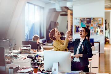 Designers celebrating in textile office