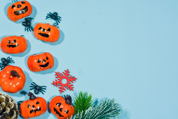 Elegant Christmas background with blue and gold decorations, including baubles, stars, and wrapped...