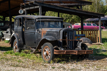 Vintage Car Showcase in Rustic Garage Setting