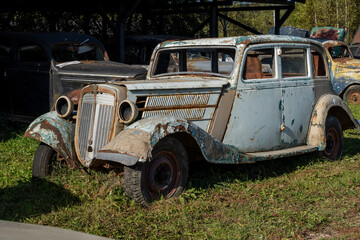 Vintage Car Decay in Abandoned Junkyard Setting