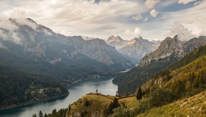 Naklejka premium Majestic mountains in Val de Aran enveloped in clouds, showcasing seasonal change