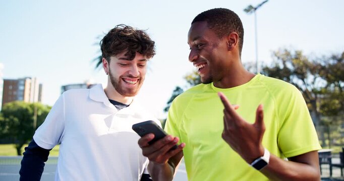 Men, friends and phone at tennis court, laugh and talk on break with meme at fitness club. People, happy and athlete on smartphone, mobile app and chat for tips, guide or tutorial video for training