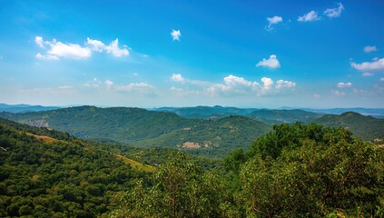 Fototapeta premium Beautiful landscape view featuring lush greenery and a serene sky, ideal for outdoor exploration