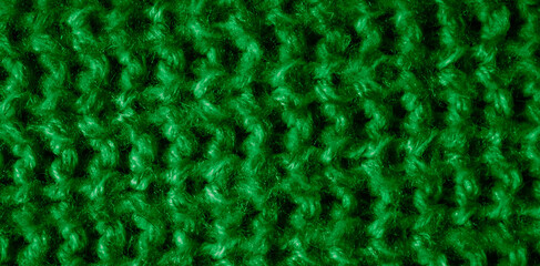 green woolen material with an interesting pattern
