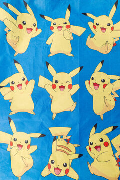 Bradford, UK Oct 30 2025 - Pikachu pok&eacute;mon print on a blue cloth from the popular Japanese animated cartoon franchise.