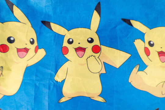 Bradford, UK Oct 30 2025 - Pikachu pok&eacute;mon print on a blue cloth from the popular Japanese animated cartoon franchise.
