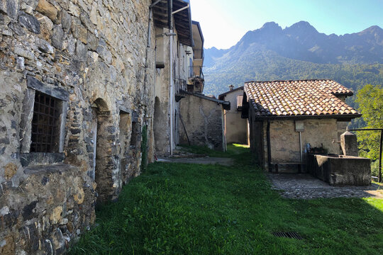 Old Stone Houses of Zambla Bassa Mountain Village in the Italian Alps during a Sunny Summer Day. Bergamo Province, Italy