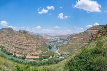 Wide-angle shot of a mountainous valley scenery