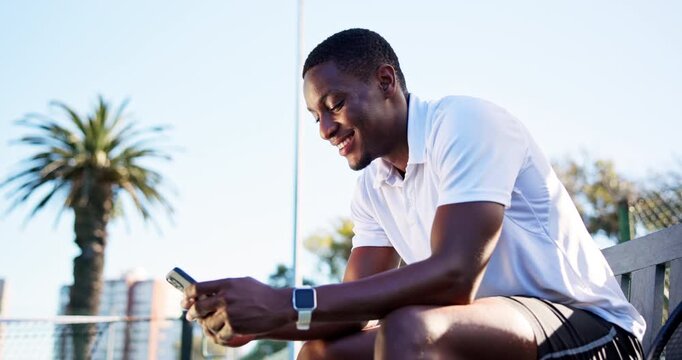 Tennis, sports and black man with phone for rest, break and online for workout app, social media and internet. Fitness, happy and person on smartphone for training, exercise post or practice for game