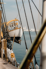 Wooden lifeboat and ropes on deck of sailing vessel © Vera